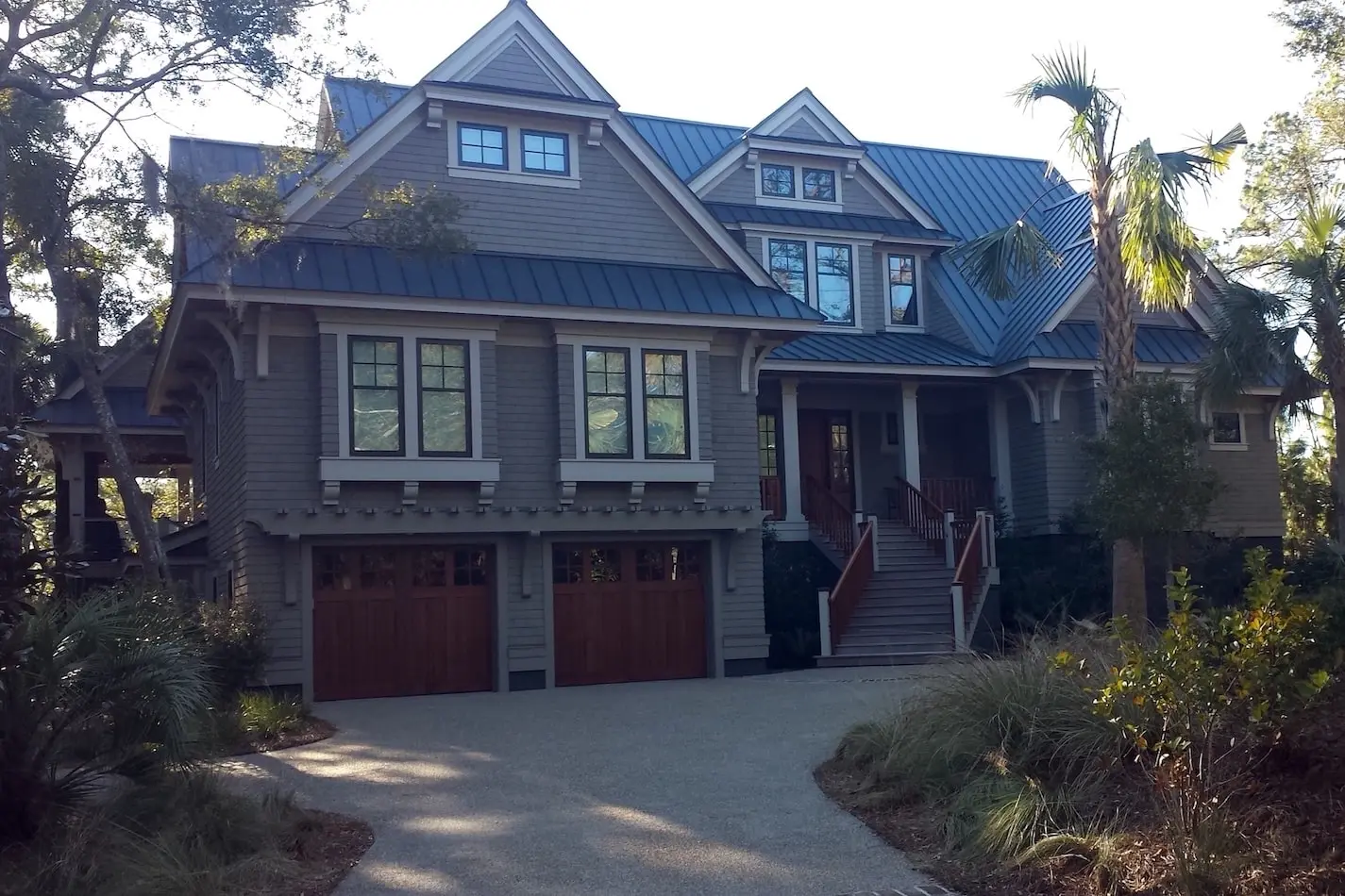Residential house with standing seam metal roofing.